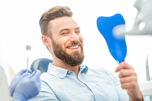 Patient smiling at dental checkup and cleaning