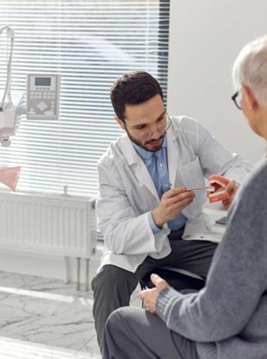 Dentist and patient talking during consultation