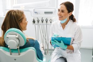 Patient chatting with dentist.